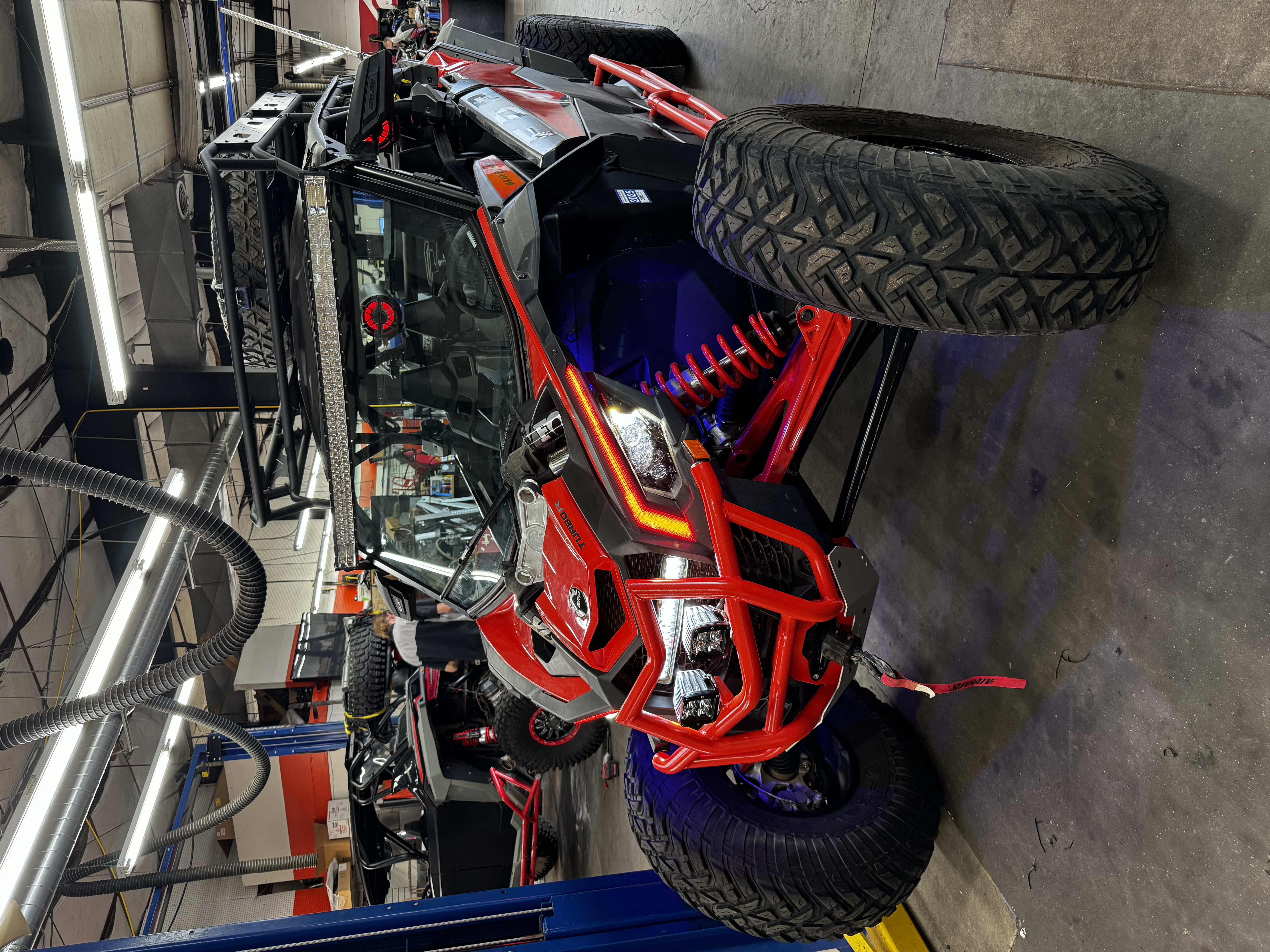 Red Can-Am Maverick X3 service work