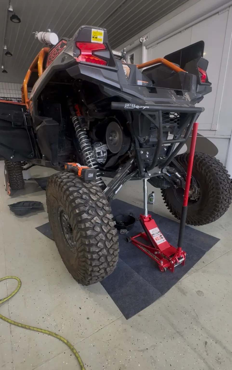 Polaris RZR raised for clutch and drivetrain service by LB Off-Road Works