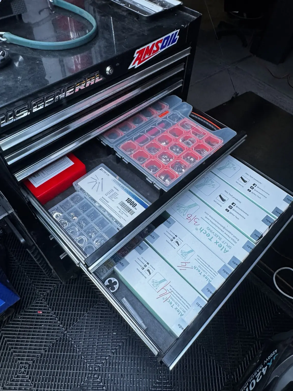 Organized electrical terminals, cotter pins, and repair supplies in a mobile tool chest